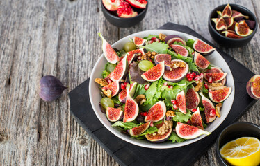Fresh fruit salad with figs, grapes and pomegranates
