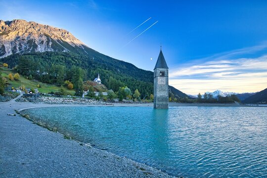 Church tower at the shore of Lake Resia