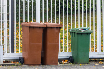 Fototapeta premium garbage sorting. colorful trash cans in the backyard.waste recycling
