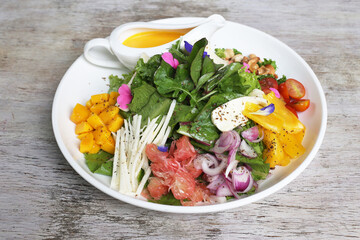 The local salad served in a dish isolated on grey background side view of salad