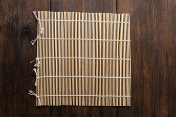 roll mat on dark wooden background