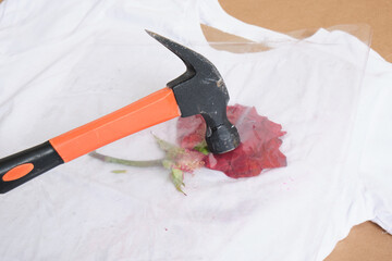 rose petals under pressure, eco print on t-shirt, beat off the flowers with a hammer and leave a mark on the t-shirt