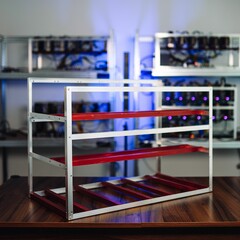 Selective focus shot of stackable open air mining rig frame miner case