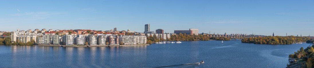 Fototapeta na wymiar Panorama view, the Lux district, island Lilla Essingen, office and skyscrapers, bridge Västerbron the district Södermalm, the lake Mälaren. sunny a color full autumn day in Stockholm