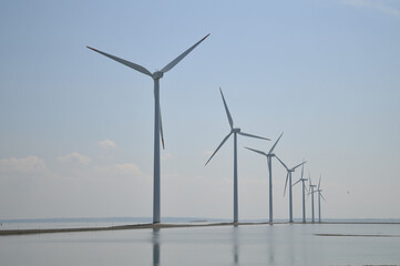 Fototapeta premium Wind farm windmills on the sea in Denmark