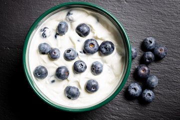 blueberry yogurt on a black background