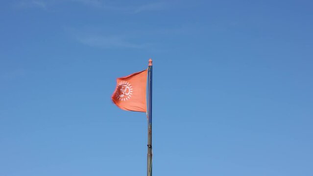 flag flying high in a temple in India, Indian temple flag. Not Indian national flag.