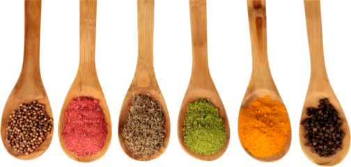 Various colorful spices in spoons on white table