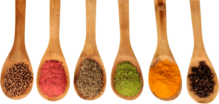 Various colorful spices in spoons on white table