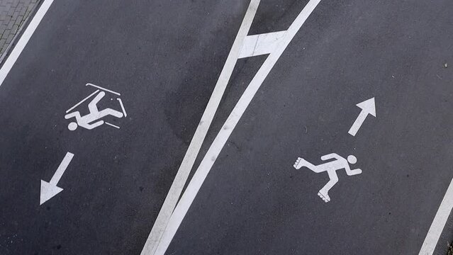 Track for cyclists and rollerblading in a city park, top view. Sport track