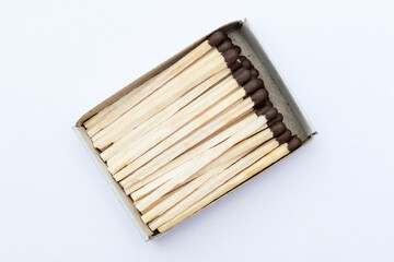 Match box full of matches close up on white background