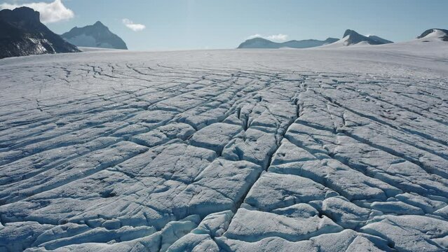 Arctic Snow Polar Frozen Tundra. mountain peaks in this polar region. Sloping glacial valleys Norway glacier