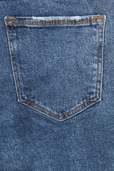Blue denim pocket for background. Close-up of the back of a denim pants. Close-up denim pocket. Denim texture background.
