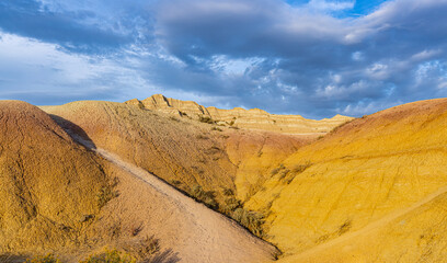 Yellow Mounds Basin With The Peaks of  Dillon Pass, Badlands National Park, South Dakota, USA
