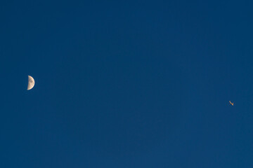 Airplane (commercial aircraft) and moon.
