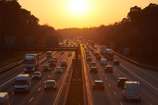 Sundown over motorway at rush-hour