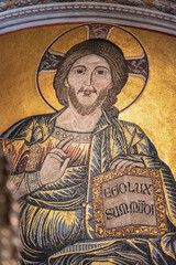 Close-up on golden fresco portraiting Jesus Christ