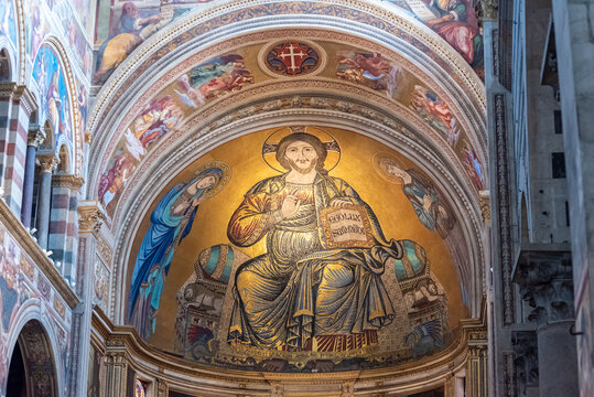 Beautiful golden fresco decorating dome interior inside catholic basilica in Pisa