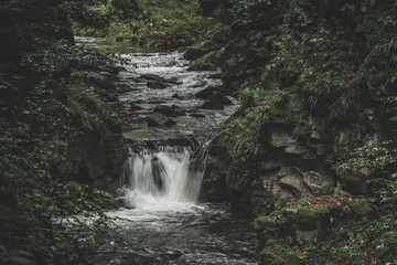 Fototapeta premium Mountain waterfall during fall