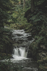Mountain waterfall during fall
