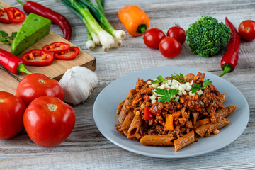 Italian spaghetti with ingredients on a wooden table