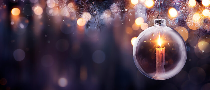 Christmas Hope - Advent Candle With Bright Flame In Ball Hanging Tree With Defocused Background - Prayer Concept
