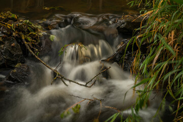 Mnichovsky creek near Mnichov and Sitiny villages in autumn dark cloudy morning