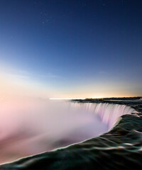 Stars over Horseshoe Falls closeup in the morning with mist at Niagara Falls in Canada, slow shutter speed, long exposure