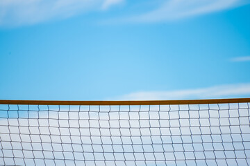Beach volleyball net at a beach.