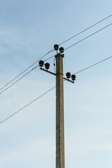 electric pole with wires against the sky