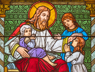 Obraz na płótnie Canvas ZURICH, SWITZERLAND - JUNE 27, 2022: The Jesus among the children in St. Peter und Paul church by Albin Schweri (1885 - 1946).