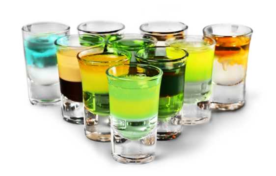 Colourful shot drinks on a white background with reflections