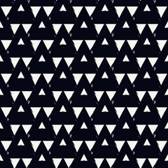Seamless pattern. Paint brush triangles ornament. Hand drawn geometrical backdrop. Triangular shapes wallpaper. Geometric figures background. Ethnic motif. Textile print. Vector abstract.