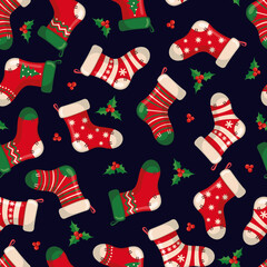 Cute seamless pattern with red socks in flat style for Christmas and New Year holiday.