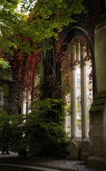Vertical shot of the St Dunstan churchyard with decorative greenery