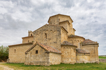 Obraz premium View of the Romanesque church of Nuestra Señora de La Anunciada, with a cloudy sky. Urueña, Valladolid, Castilla y Leon, Spain