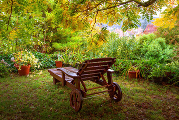 wooden lounger for relaxing in the autumn garden