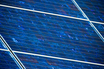 Electricity producing photovoltaic solar panels on a rooftop