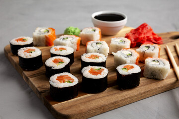 Homemade Sushi Platter with Wasabi and Soy Sauce on a Board, low angle view.