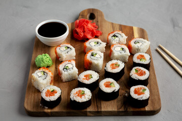Homemade Sushi Platter with Wasabi and Soy Sauce on a Board, side view.