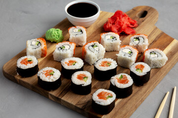 Homemade Sushi Platter with Wasabi and Soy Sauce on a Board, low angle view.
