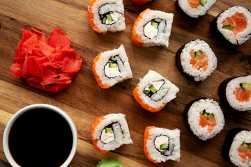 Homemade Sushi Platter with Wasabi and Soy Sauce on a Board, top view. Flat lay, overhead, from above.