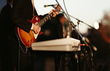 man with guitar on the concert 