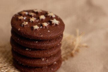 Close-up shot of round chocolate christmas cookies on brown kraft paper