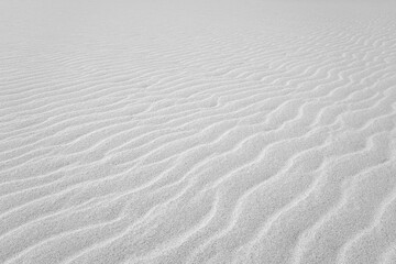 Close up on Beach Sand texture background for wallpaper and poster. Sandy beach. Side Top view.