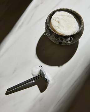 Razor And Soap On White Marble 