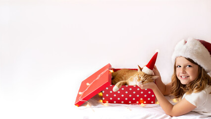 cute girl hugging a beautiful cat. cat as a gift to a child for christmas. beautiful red cat in a New Year's hat sleeps in a red gift box.