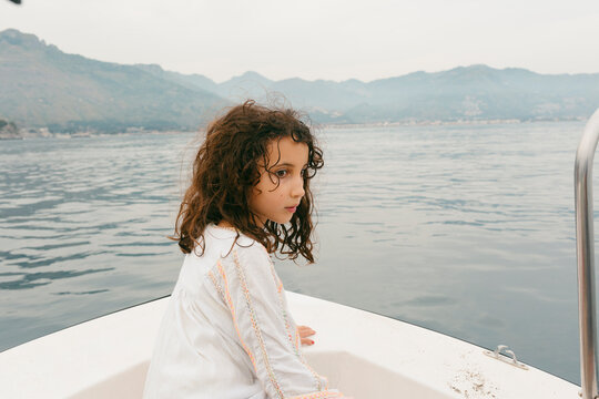 Kid on Boat trip in the Mediterranean sea along the coastline