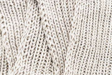 Knitting. Vertical striped beige knit fabric texture, knitted pattern background. Top view