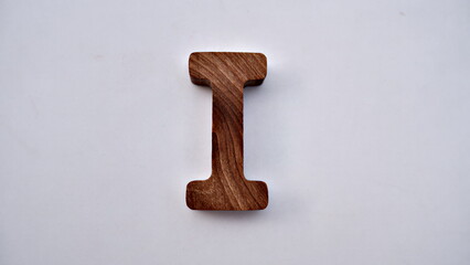 Wooden textured alphabet letters on a white background , selected focus isolated photo
